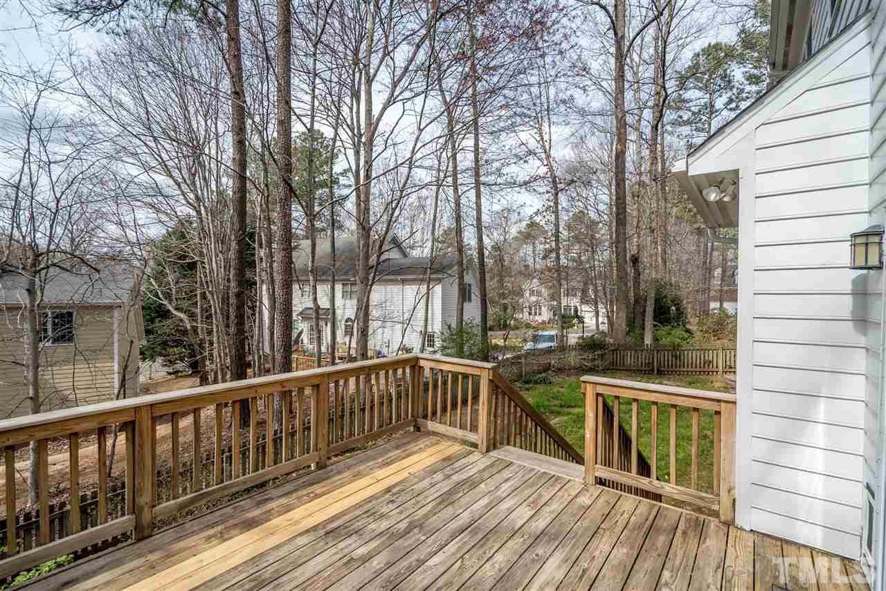 9905 Rimwood Court Raleigh, NC 27613 - Photo 24 of 24 a view of balcony with wooden floor and fence