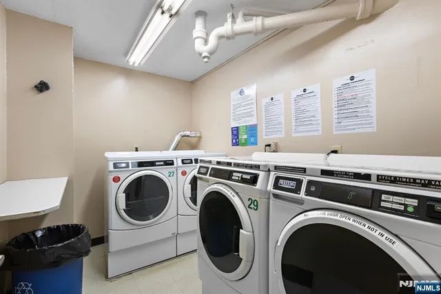 a view of a room with furniture and wooden floor