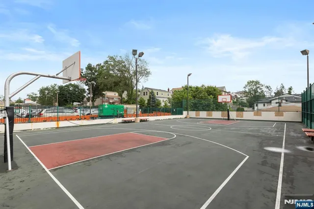 a view of a park with swings and slides