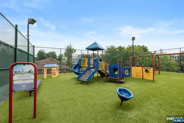 a swimming pool with outdoor seating and yard