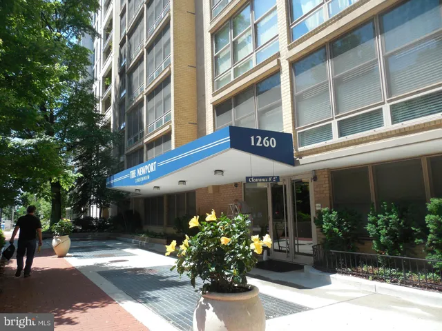 a front view of a building with a potted plant