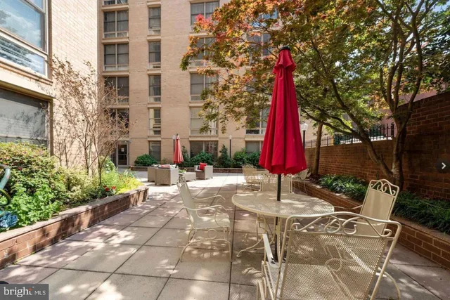 a couple of cars parked in front of a building