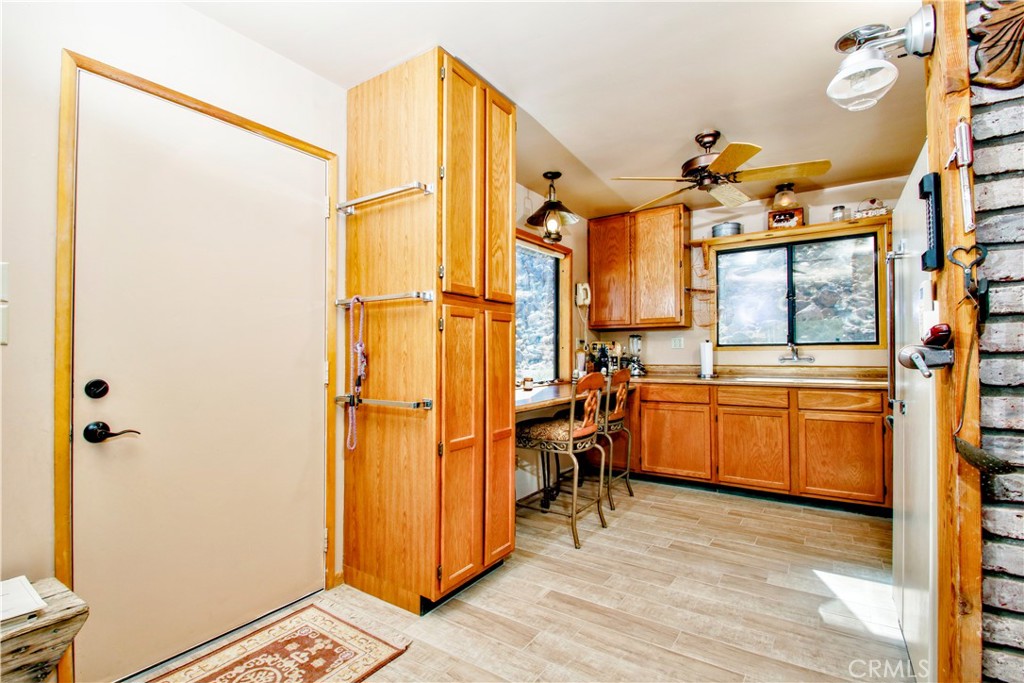 4650 Sizer Canyon Road Johnson Valley, CA 92285 - Photo 5 of 36 a view of a walk in closet and wooden floor