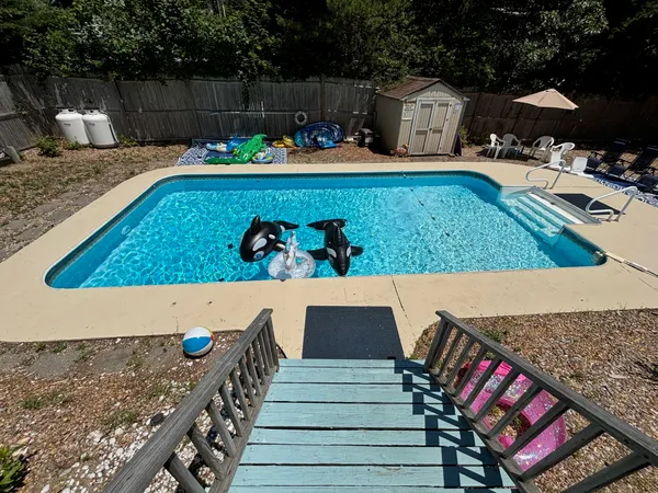 a view of swimming pool with outdoor seating