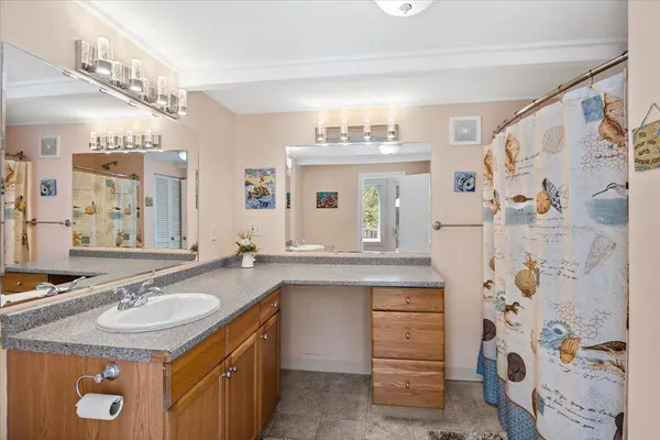 a bathroom with a sink double vanity and a mirror