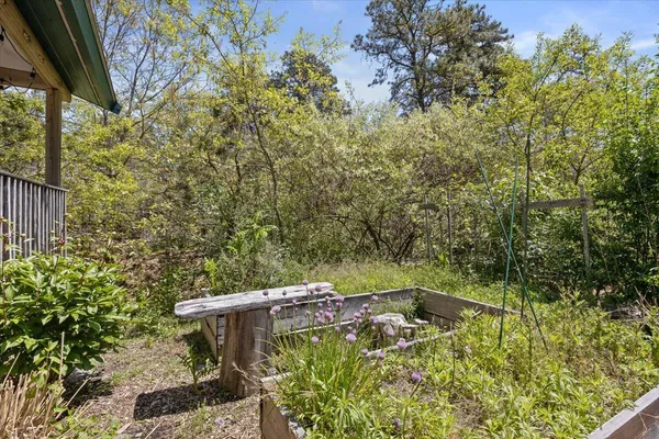a view of a chairs and table in the balcony