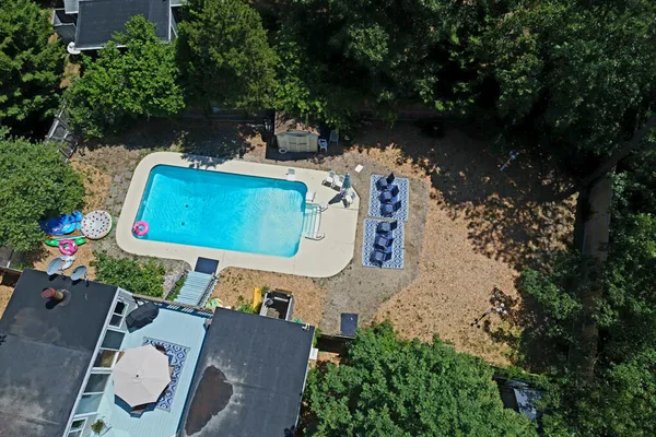 an aerial view of a house with outdoor space