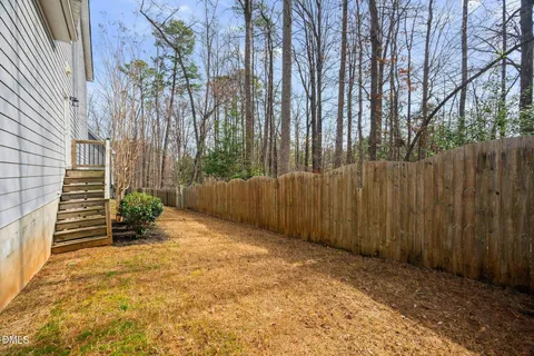 a view of a backyard with pathway