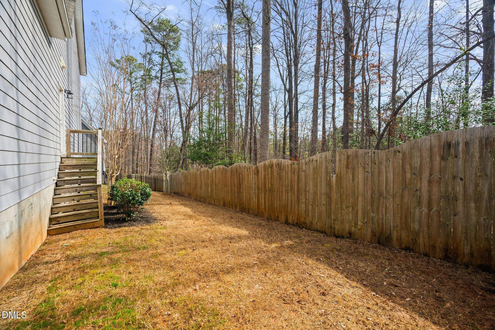 528 Spring Flower Court Cary, NC 27511 - Photo 46 of 51 a view of a backyard with pathway