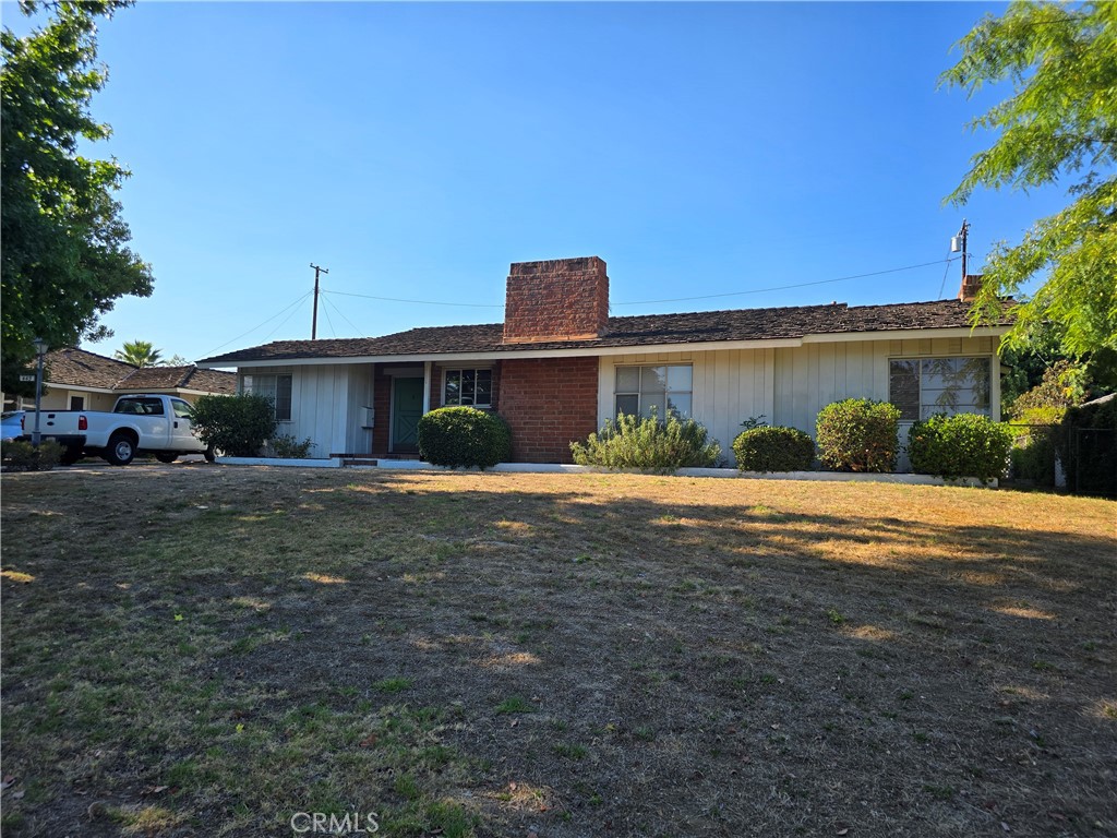 449 Cambridge Drive Arcadia, CA 91007 - Photo 1 of 1 a front view of a house with a yard and potted plants