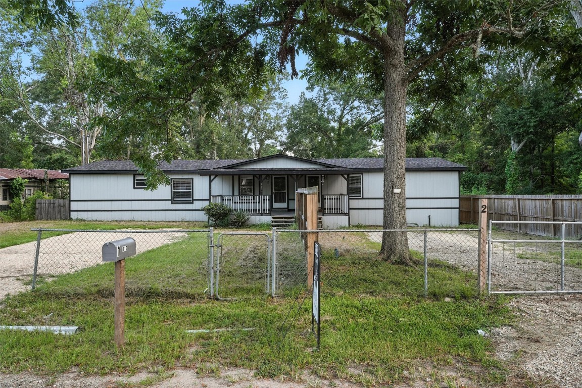 110 Robin Street Shepherd, TX 77371 - Photo 22 of 23 front view of a house with a yard