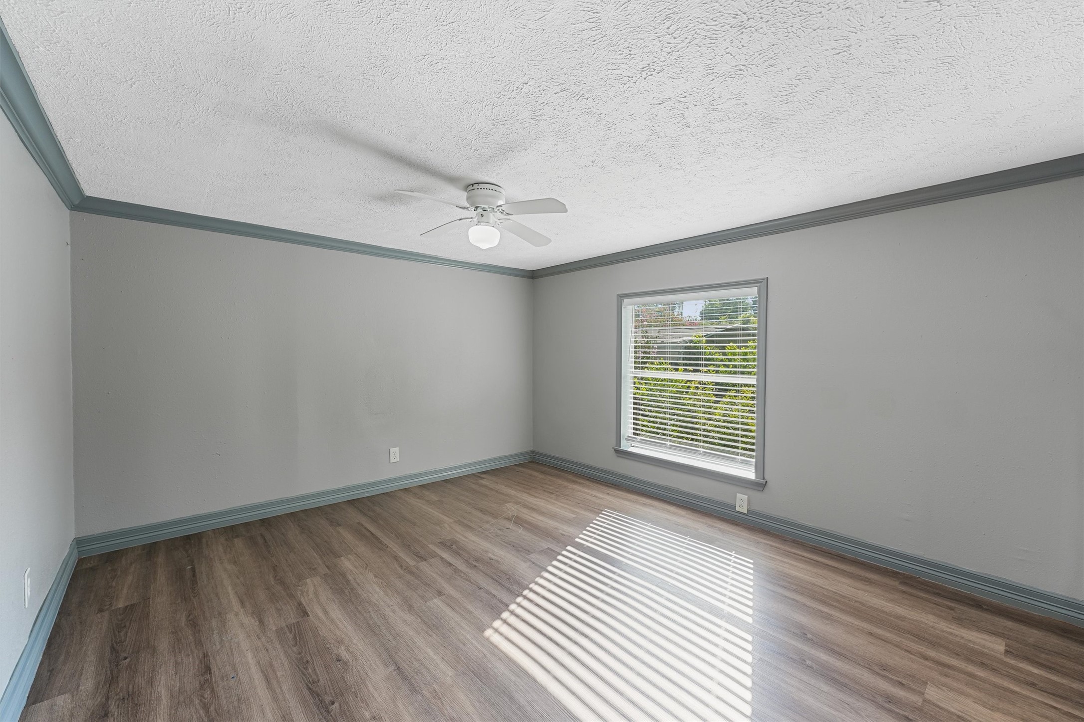 110 Robin Street Shepherd, TX 77371 - Photo 8 of 23 a view of an empty room with wooden floor and a window