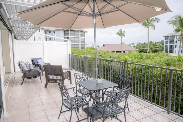 a view of a patio with furniture