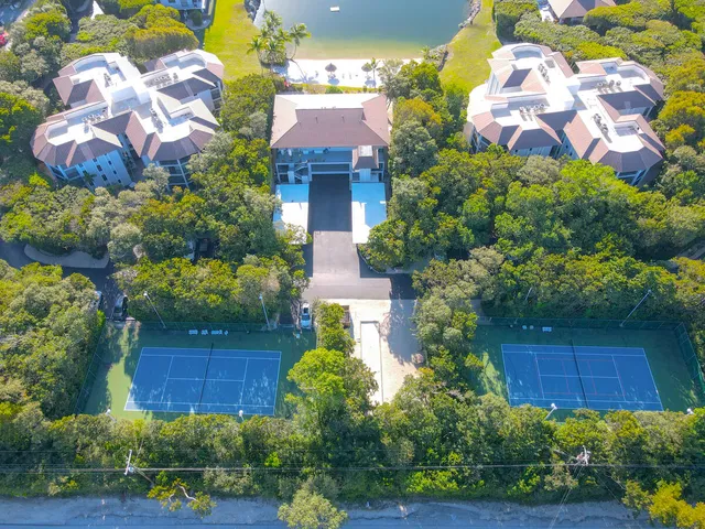 a view of a multi story building with yard