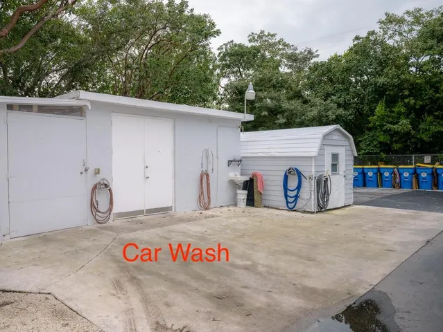 a view of house with outdoor space and lake view