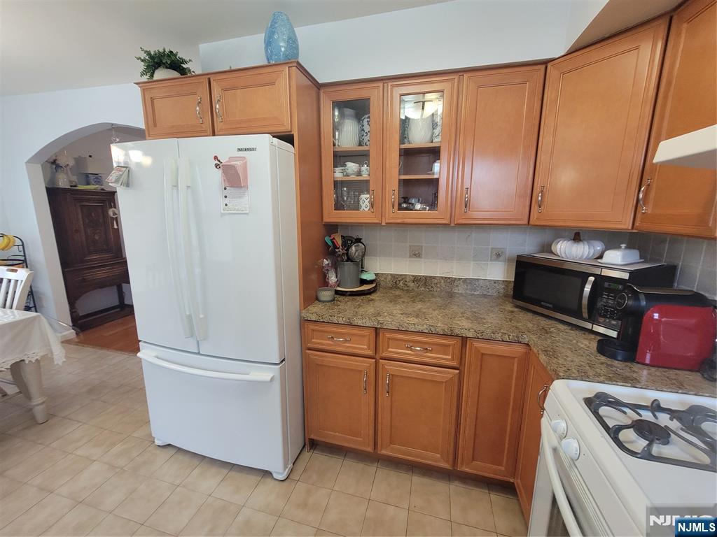 63-69 Rome Street Newark, NJ 07105 - Photo 7 of 11 a white refrigerator freezer sitting in a kitchen