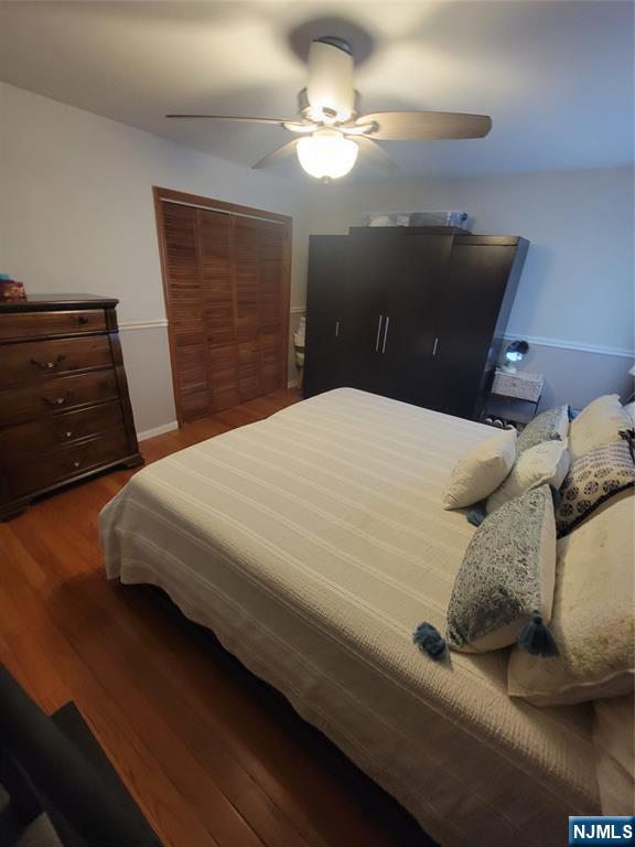 63-69 Rome Street Newark, NJ 07105 - Photo 9 of 11 a bedroom with a bed and a chandelier