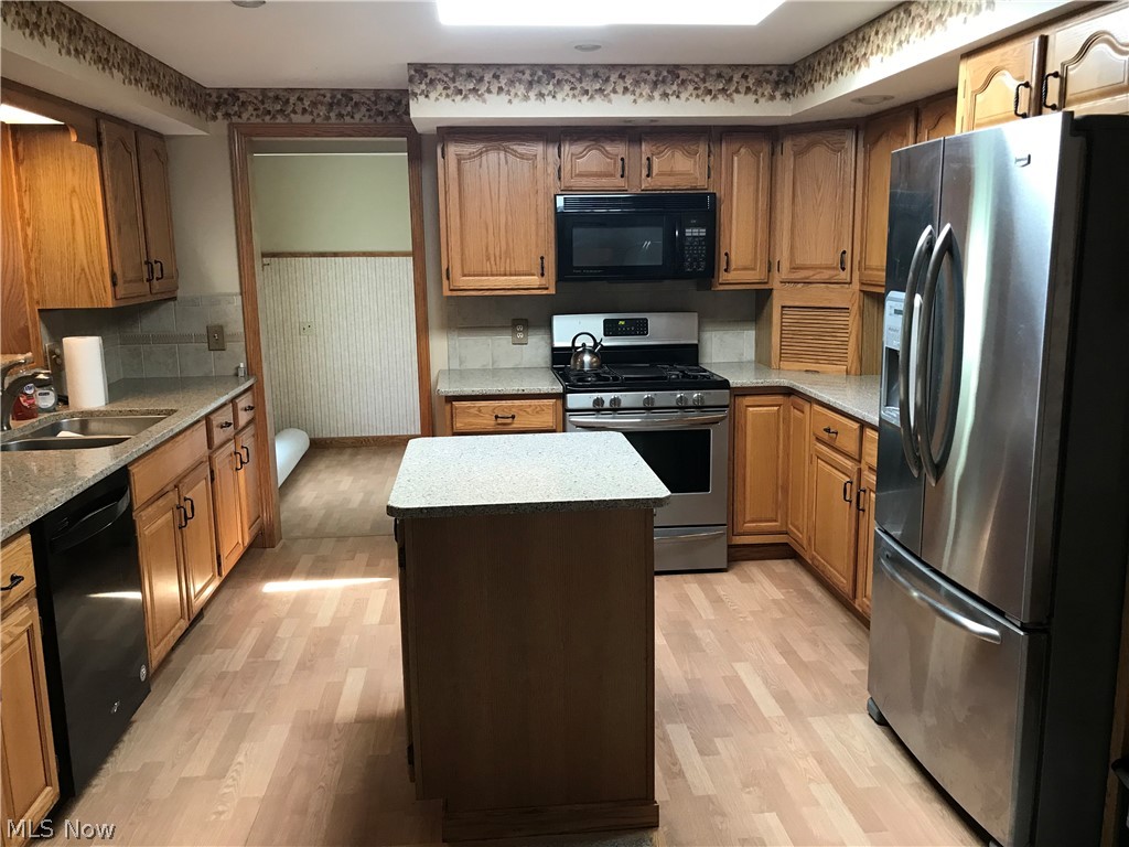 4895 4th Street Northwest Canton, OH 44708 - Photo 5 of 31 Nice sized kitchen with Pergo floors and appliances that convey
