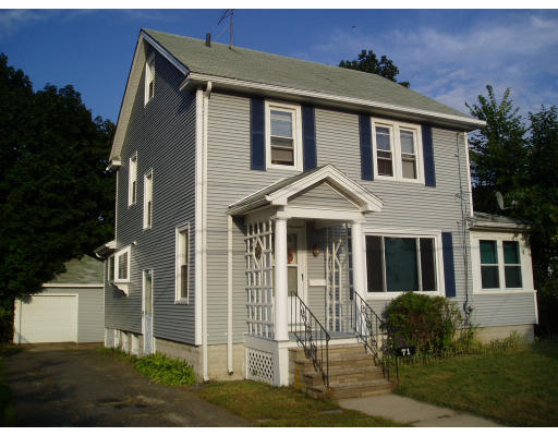 71 Edgemont Street Springfield, MA 01109 - Photo 1 of 3 a front view of a house with a yard