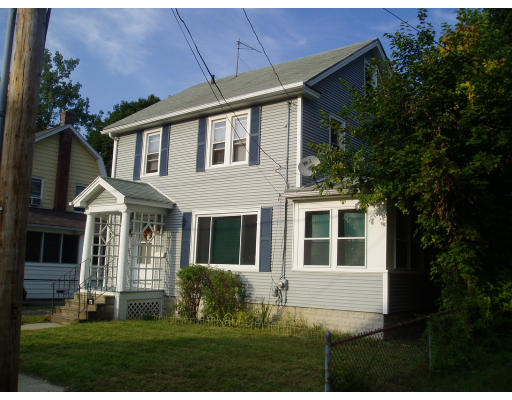 71 Edgemont Street Springfield, MA 01109 - Photo 2 of 3 a front view of a house with a yard