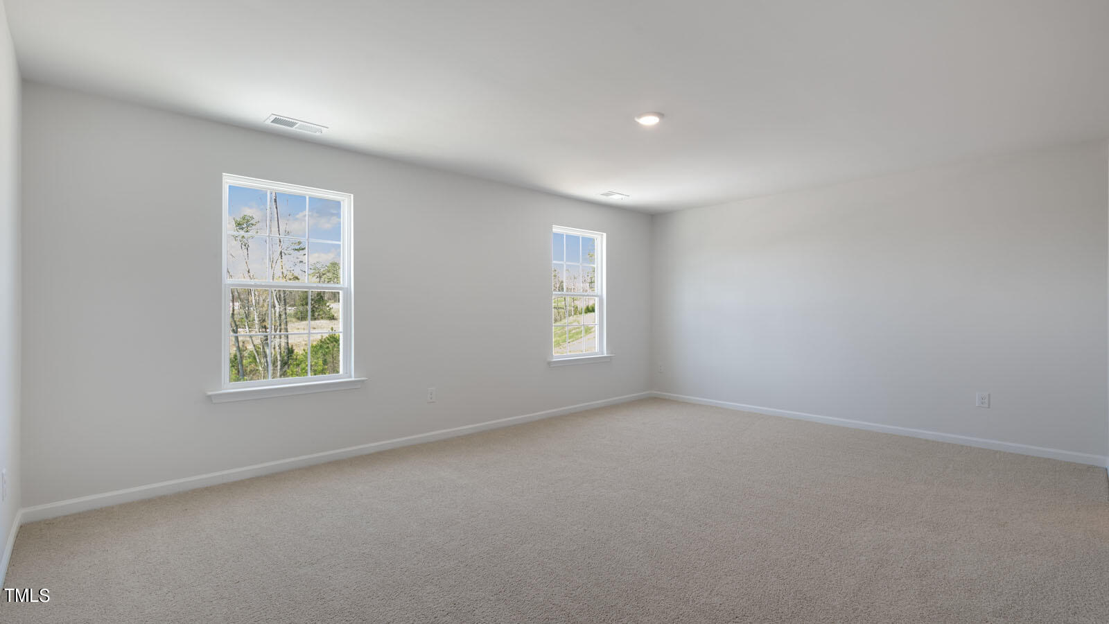361 Ashley Run Sanford, NC 27330 - Photo 12 of 46 an empty room with windows