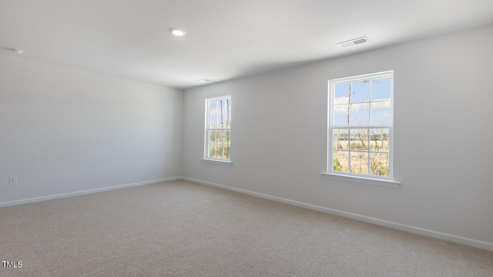 361 Ashley Run Sanford, NC 27330 - Photo 20 of 46 an empty room with windows