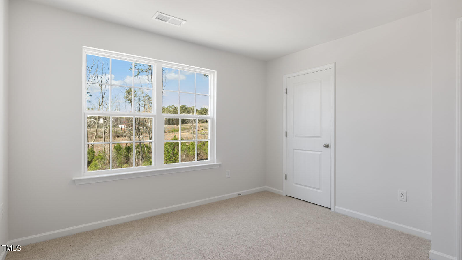 361 Ashley Run Sanford, NC 27330 - Photo 28 of 46 a view of an empty room with a window