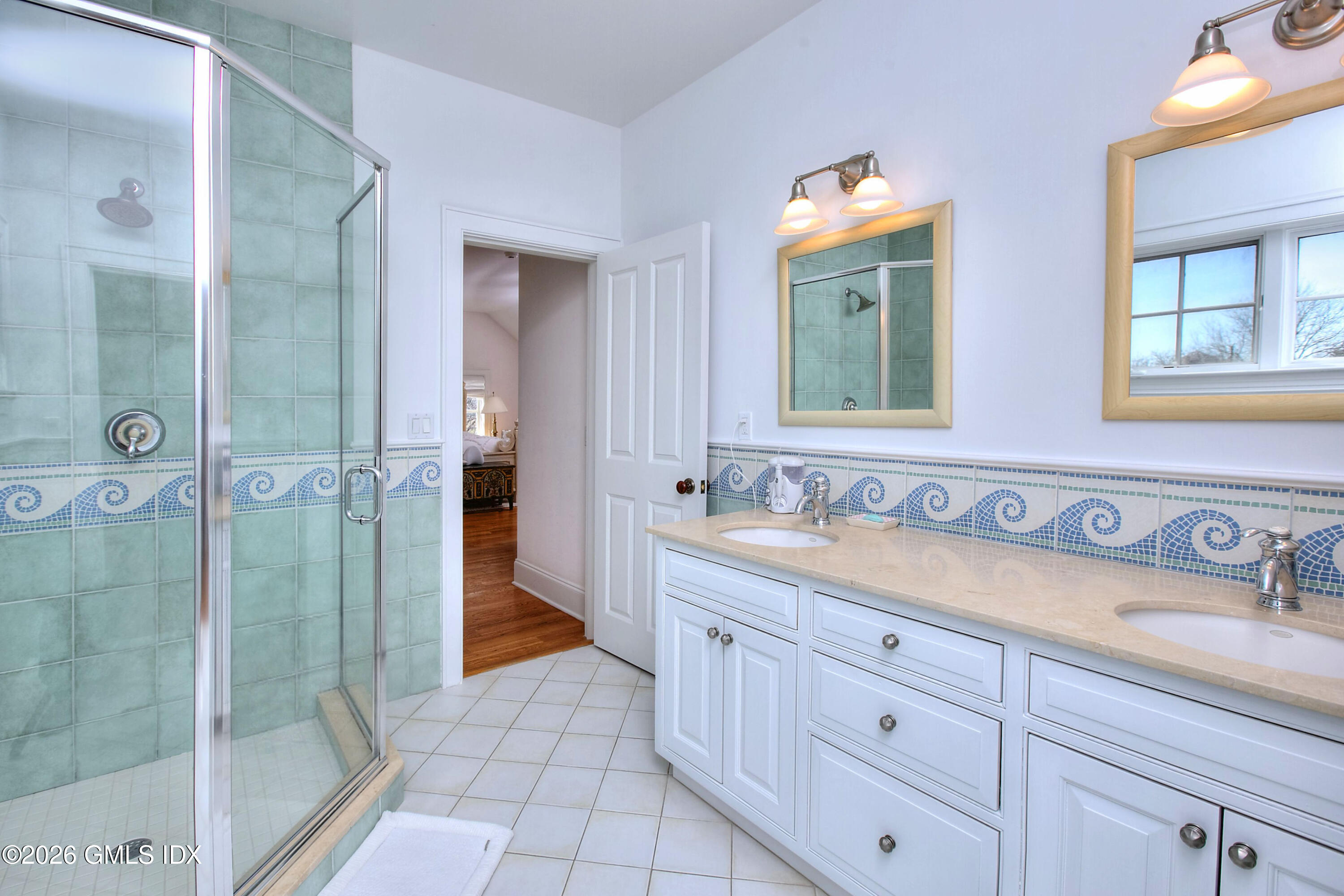 3 Shorehaven Road Norwalk, CT 06855 - Photo 31 of 40 a bathroom with a sink a mirror and a shower