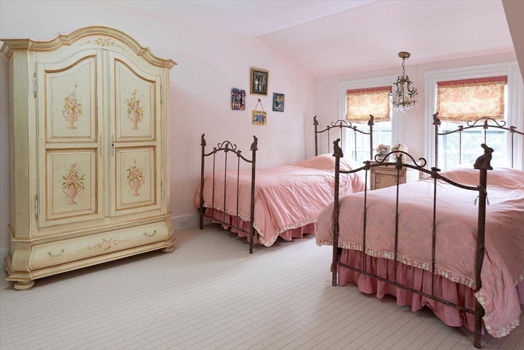 394 Hammond Street Newton, MA 02467 - Photo 14 of 24 a spacious bedroom with a bed a dresser and next to a window