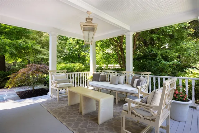 a view of a patio with a table chairs and a backyard