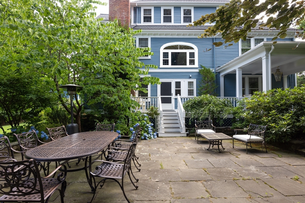 394 Hammond Street Newton, MA 02467 - Photo 20 of 24 a backyard of a house with a table and chairs