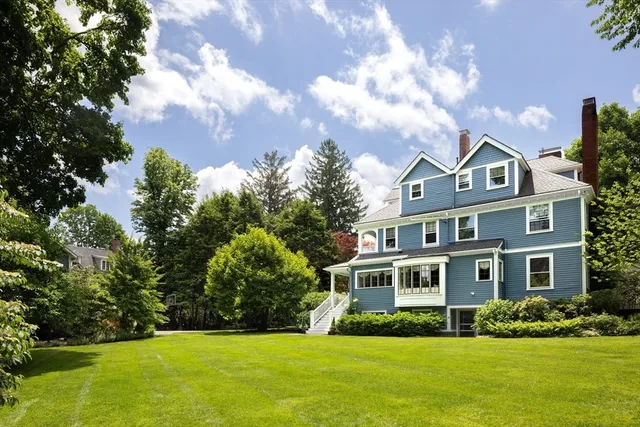 front view of a house with a tree