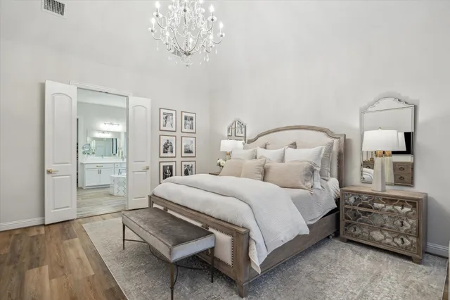 a large bathroom with a tub sink shower and mirror
