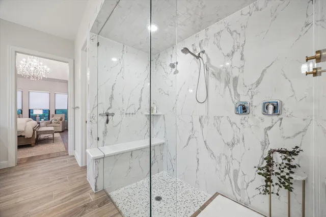 a large spacious bathroom with a tub sink and mirror