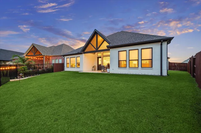a view of an chairs and table in the patio