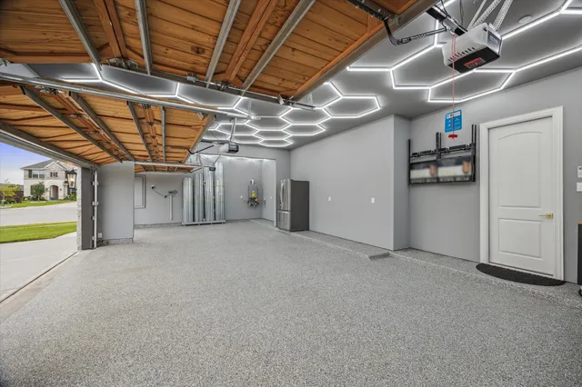 a view of empty room with wooden ceiling