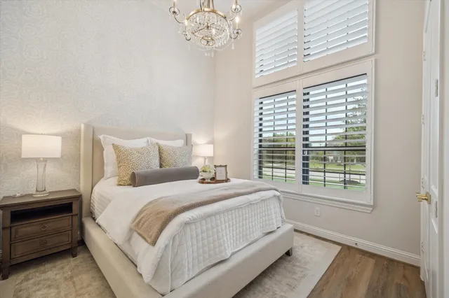 a bedroom with a large bed and a window