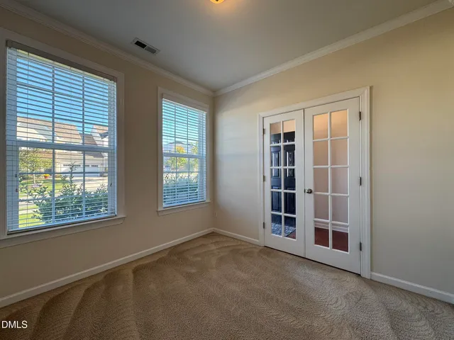 an empty room with windows