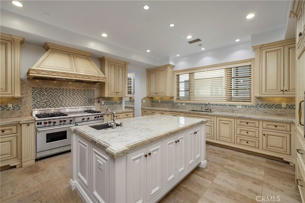 2258 Channel Road Newport Beach, CA 92661 - Photo 18 of 54 a kitchen with granite countertop white cabinets and white appliances