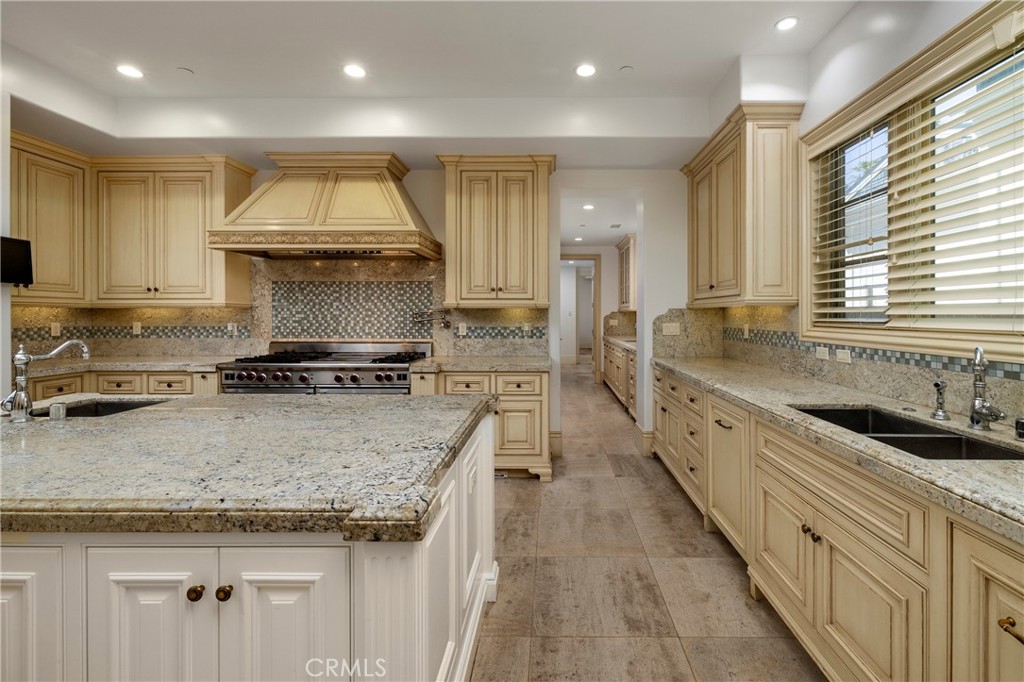 2258 Channel Road Newport Beach, CA 92661 - Photo 19 of 54 a kitchen with sink stove and cabinets