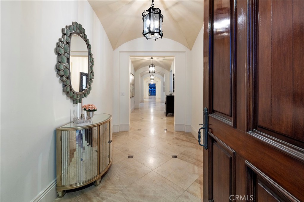 2258 Channel Road Newport Beach, CA 92661 - Photo 23 of 54 a view of a hallway with entryway wooden floor and front door