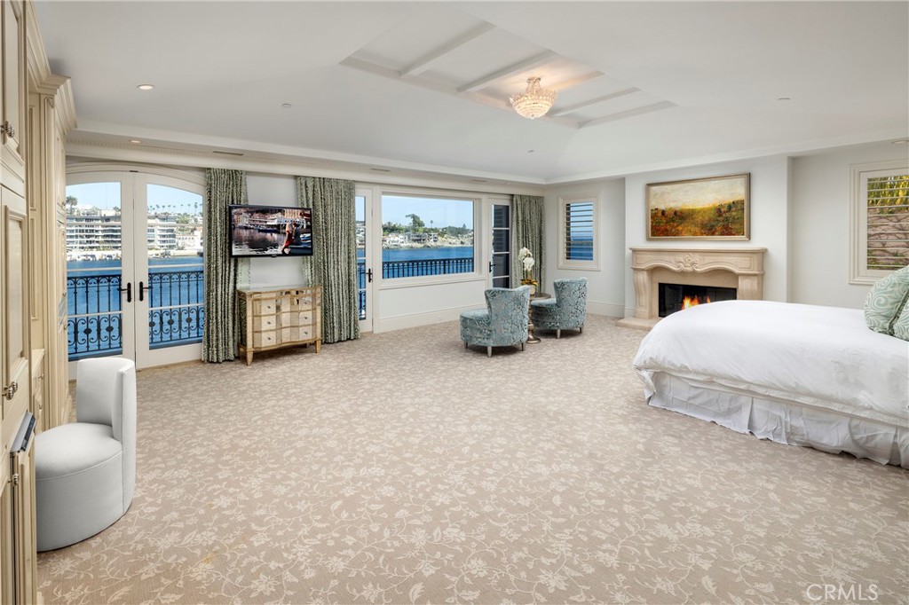 2258 Channel Road Newport Beach, CA 92661 - Photo 28 of 54 a living room with furniture large window and flat screen tv