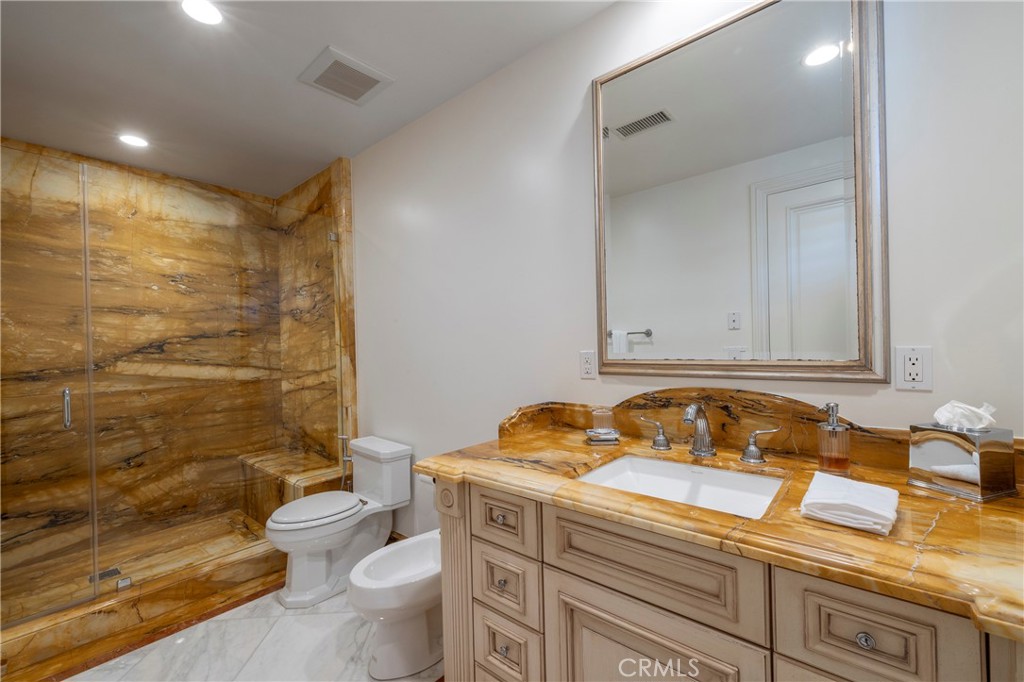 2258 Channel Road Newport Beach, CA 92661 - Photo 33 of 54 a bathroom with a sink a toilet and shower