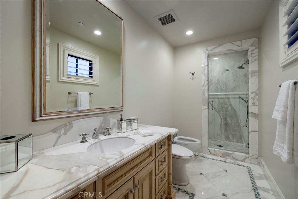 2258 Channel Road Newport Beach, CA 92661 - Photo 38 of 54 a bathroom with a granite countertop sink toilet and shower
