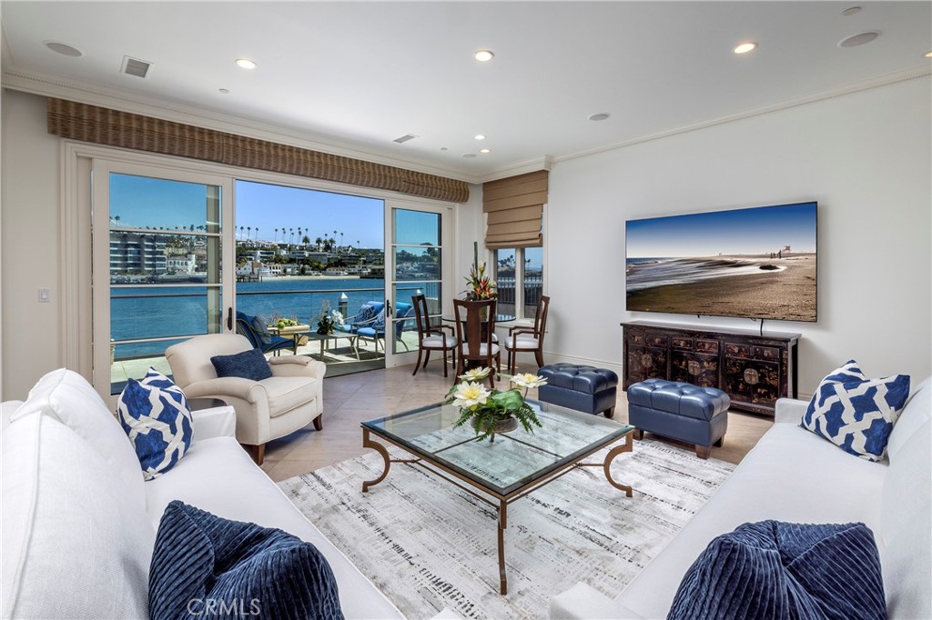 2258 Channel Road Newport Beach, CA 92661 - Photo 9 of 54 a living room with fireplace furniture and a flat screen tv