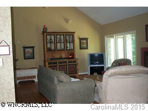72 Vintage Road Tryon, NC 28782 - Photo 3 of 7 a living room with furniture a flat screen tv and a window