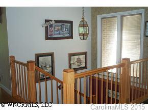 72 Vintage Road Tryon, NC 28782 - Photo 7 of 7 a view of a hallway with wooden floor and windows