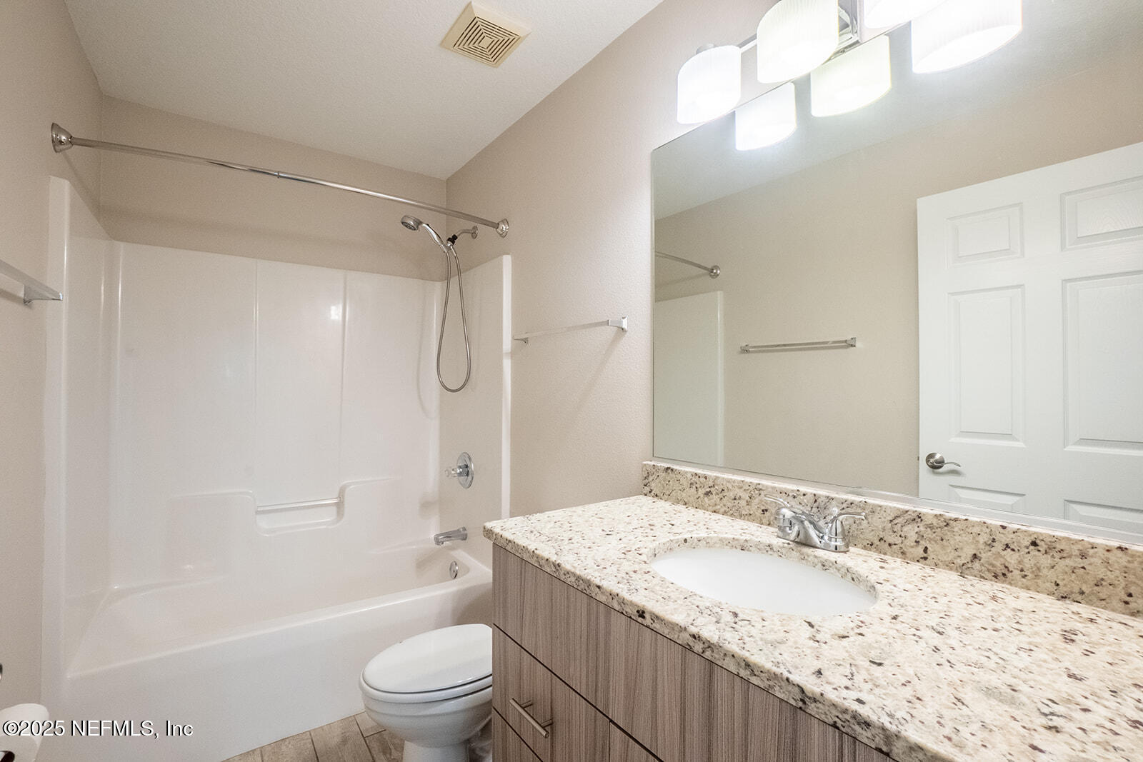 29 Edith Pope Drive Palm Coast, FL 32164 - Photo 15 of 26 a bathroom with a granite countertop sink a toilet and shower