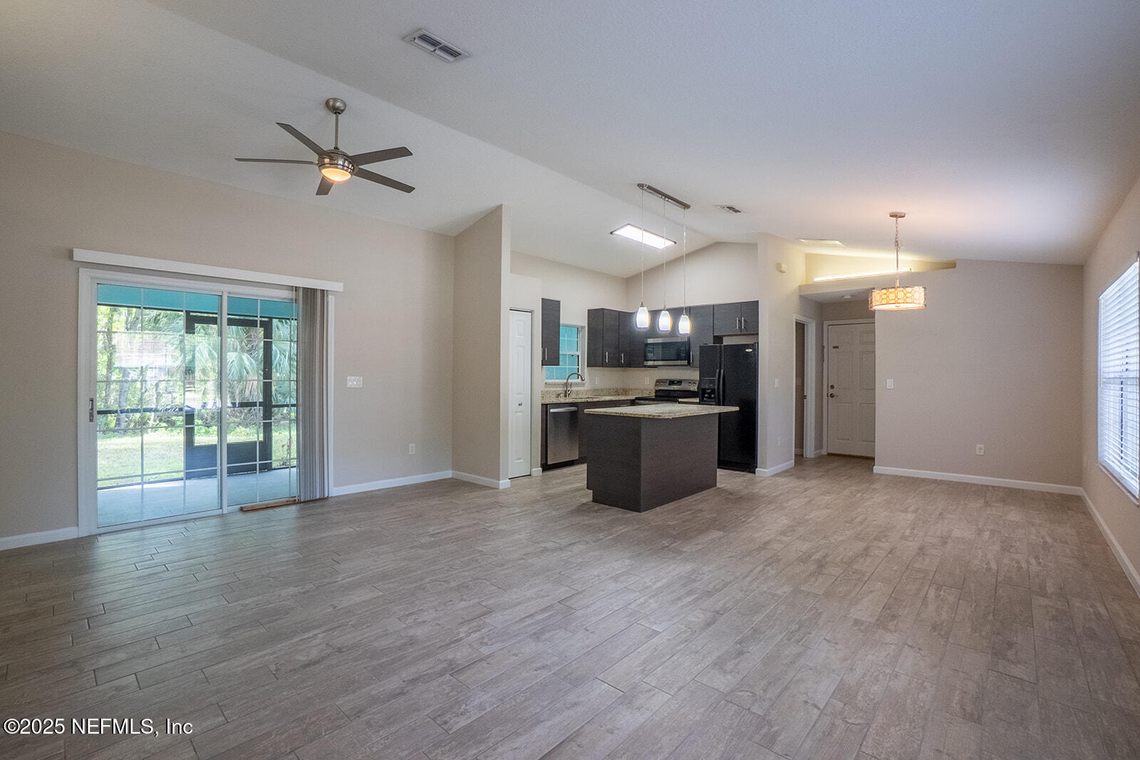 29 Edith Pope Drive Palm Coast, FL 32164 - Photo 7 of 26 a view of a kitchen with a sink cabinet and a window