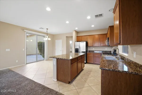 a large kitchen with stainless steel appliances lots of counter top space
